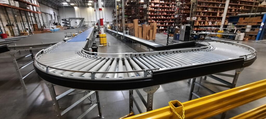 A conveyor system with a 90 degree curve that looks like a large letter U.